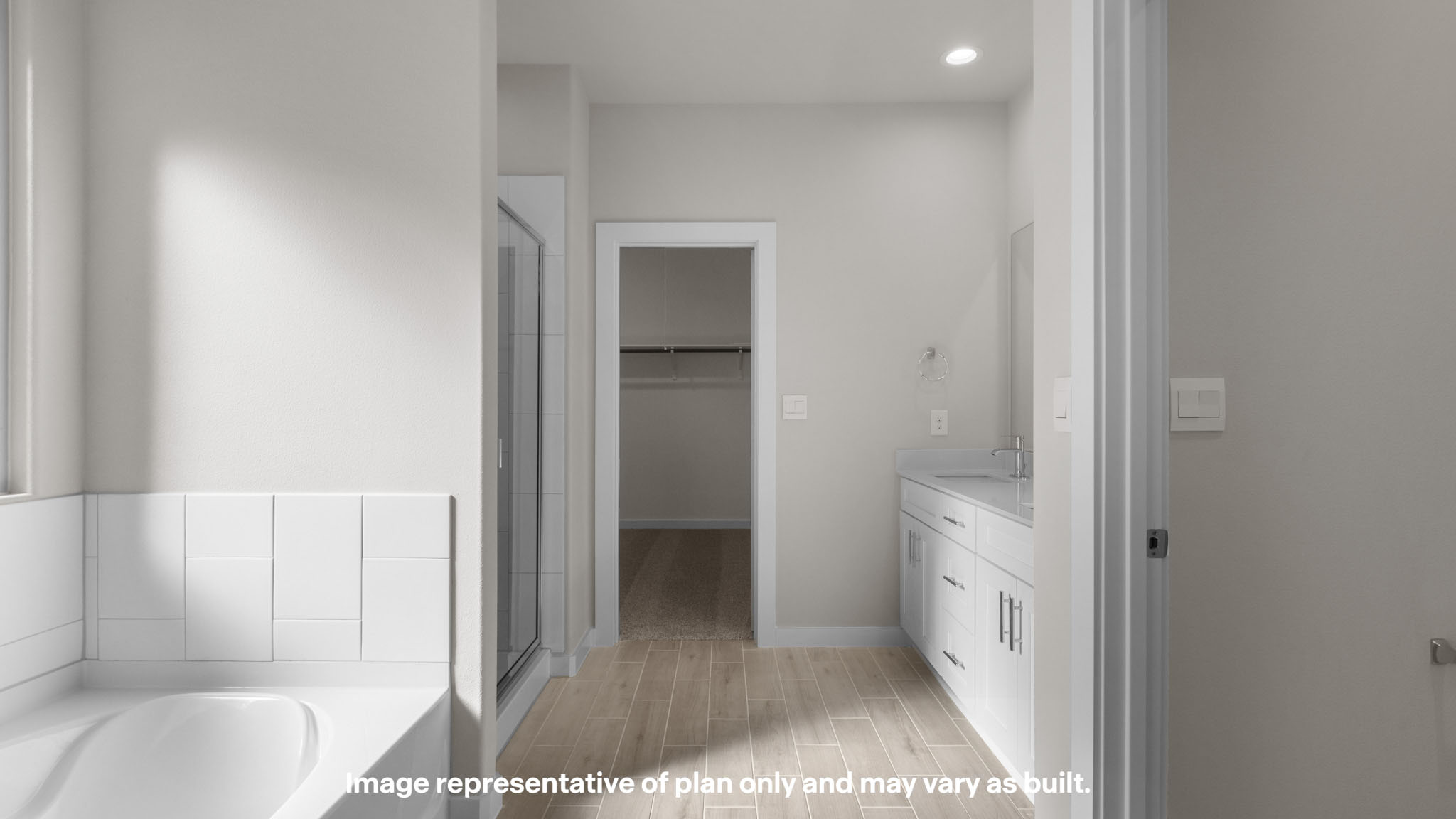 Primary bathroom with attached walk-in closet