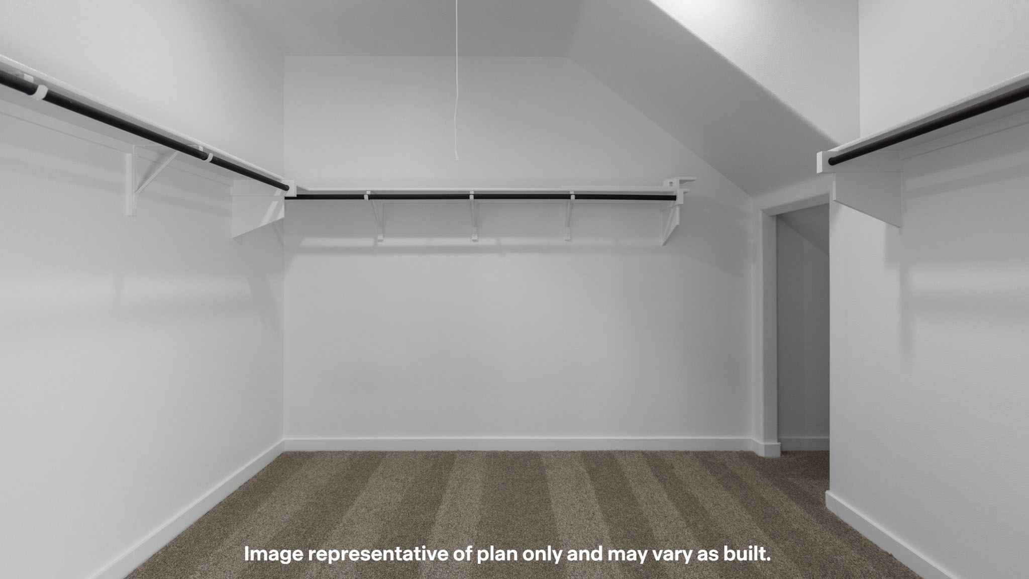 Private primary walk-in closet with extra storage space