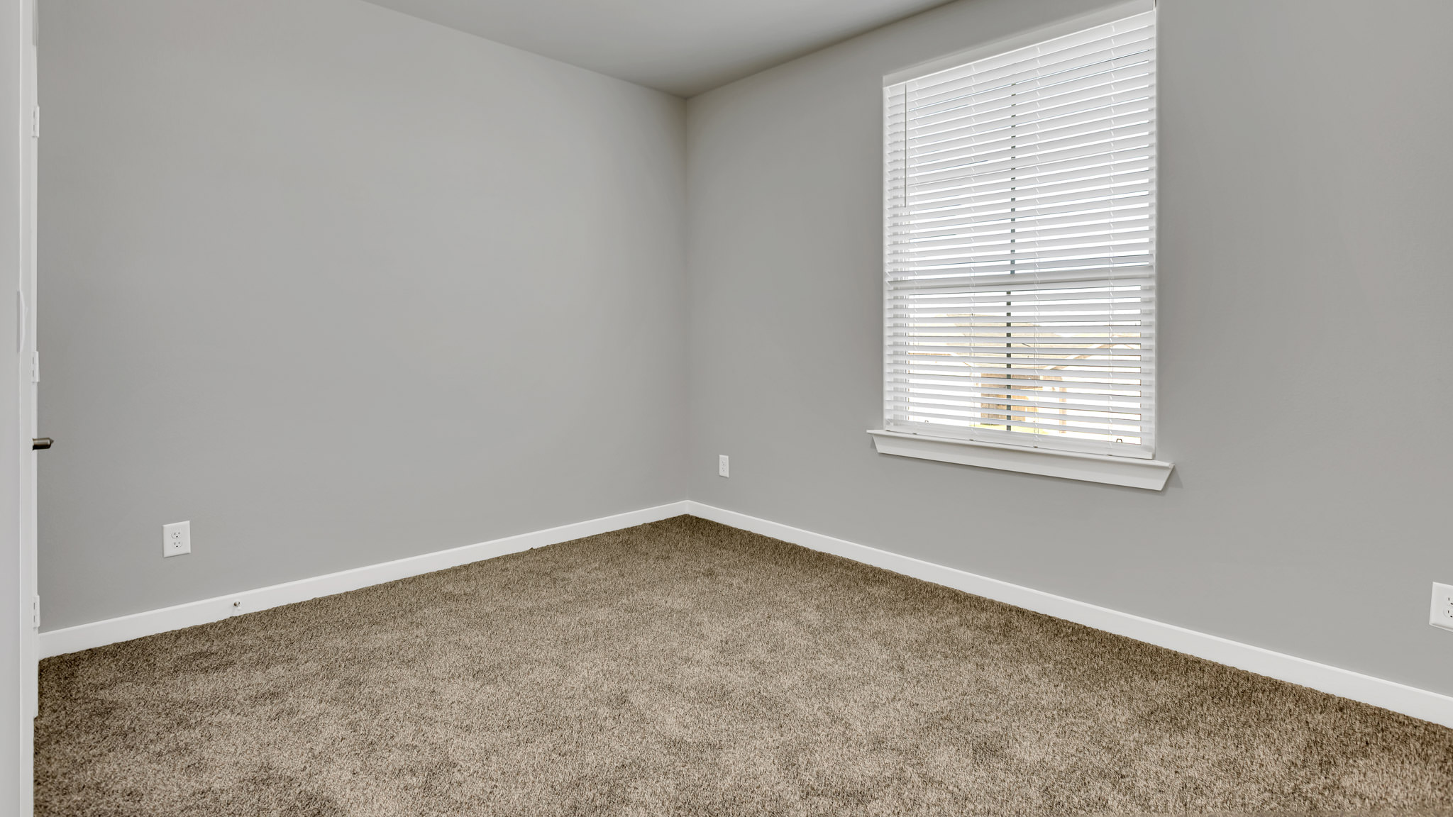Upstairs guest bedroom 3 with plush carpeted floors and ample natural light