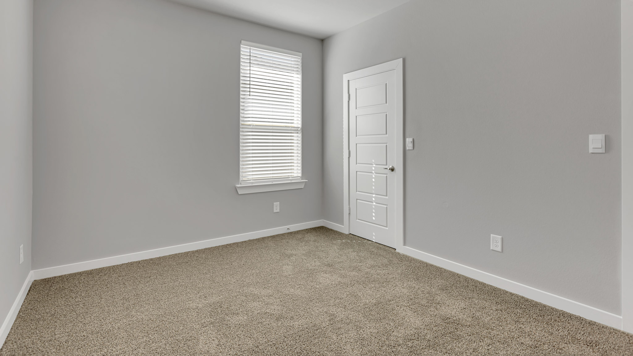 Upstairs guest bedroom 4 with plush carpet floors and side window
