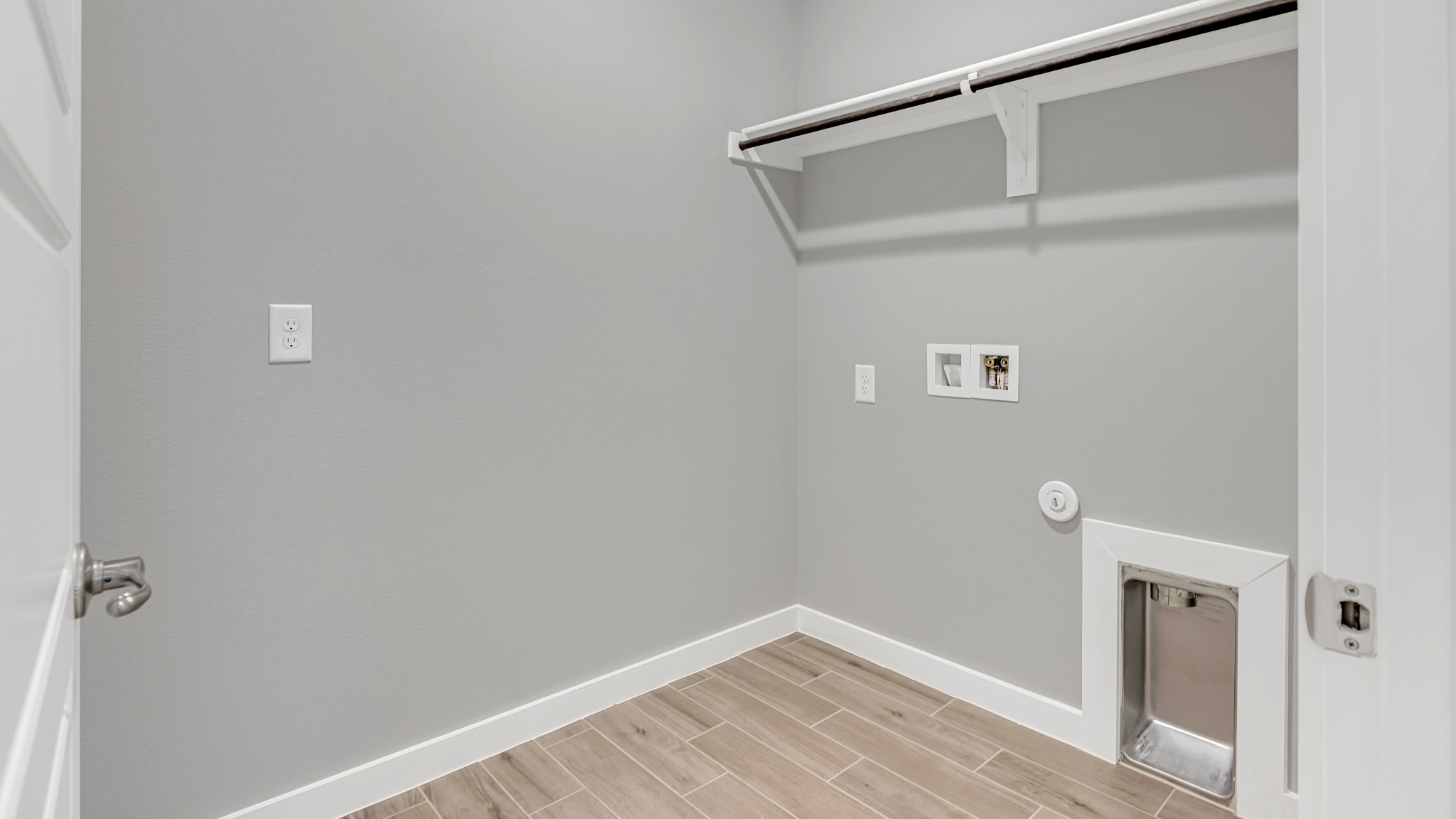 Laundry room and utility closet space with extra storage