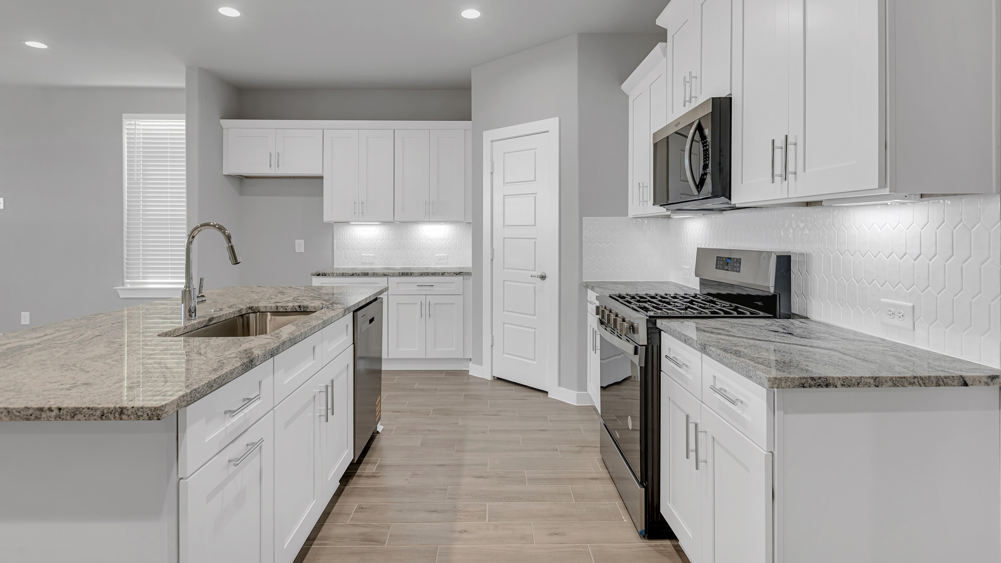 Spacious open concept kitchen with island and counter prep space