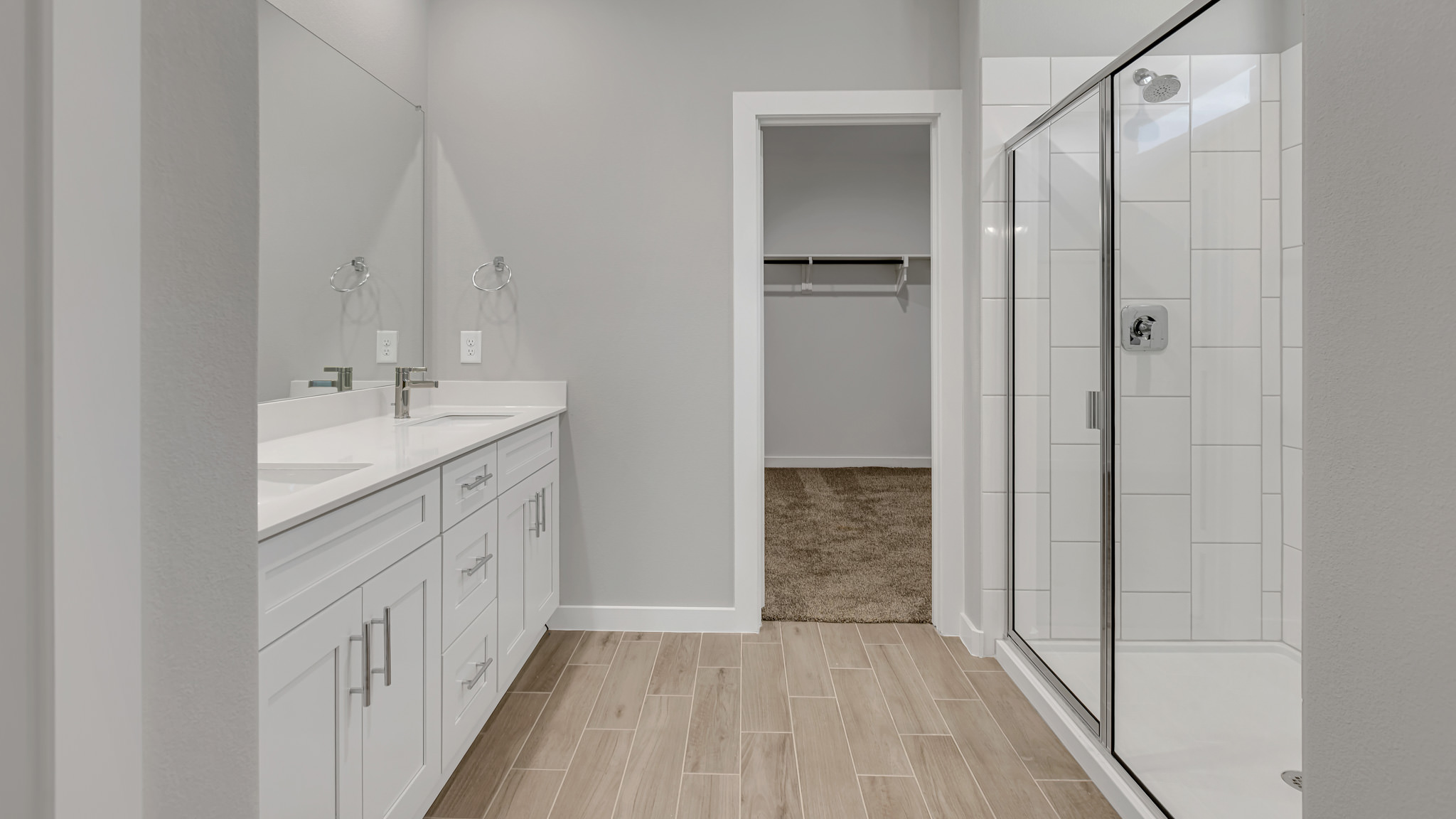 Primary bathroom with luxurious shower and built in storage