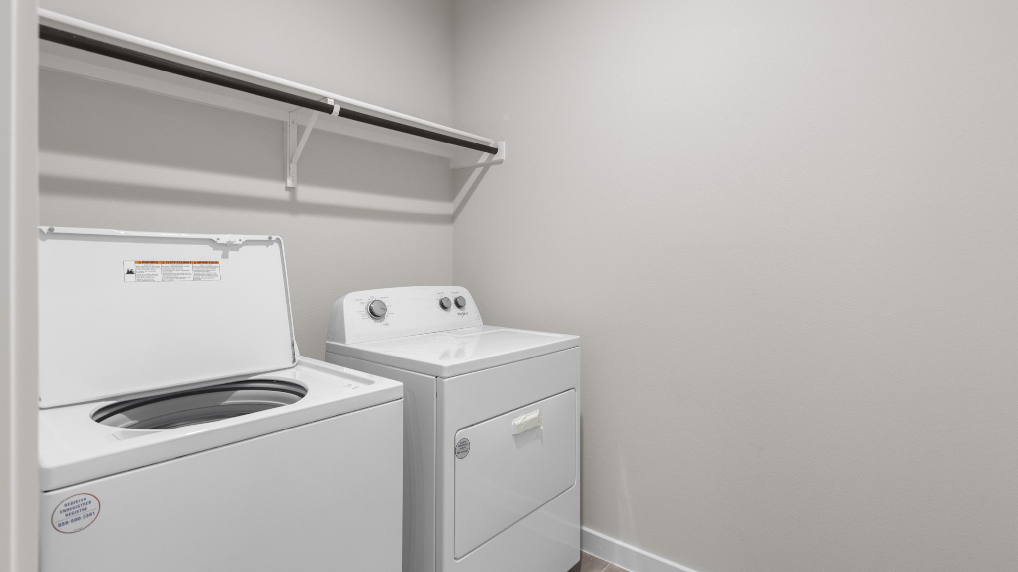 Laundry room and utility closet with storage space
