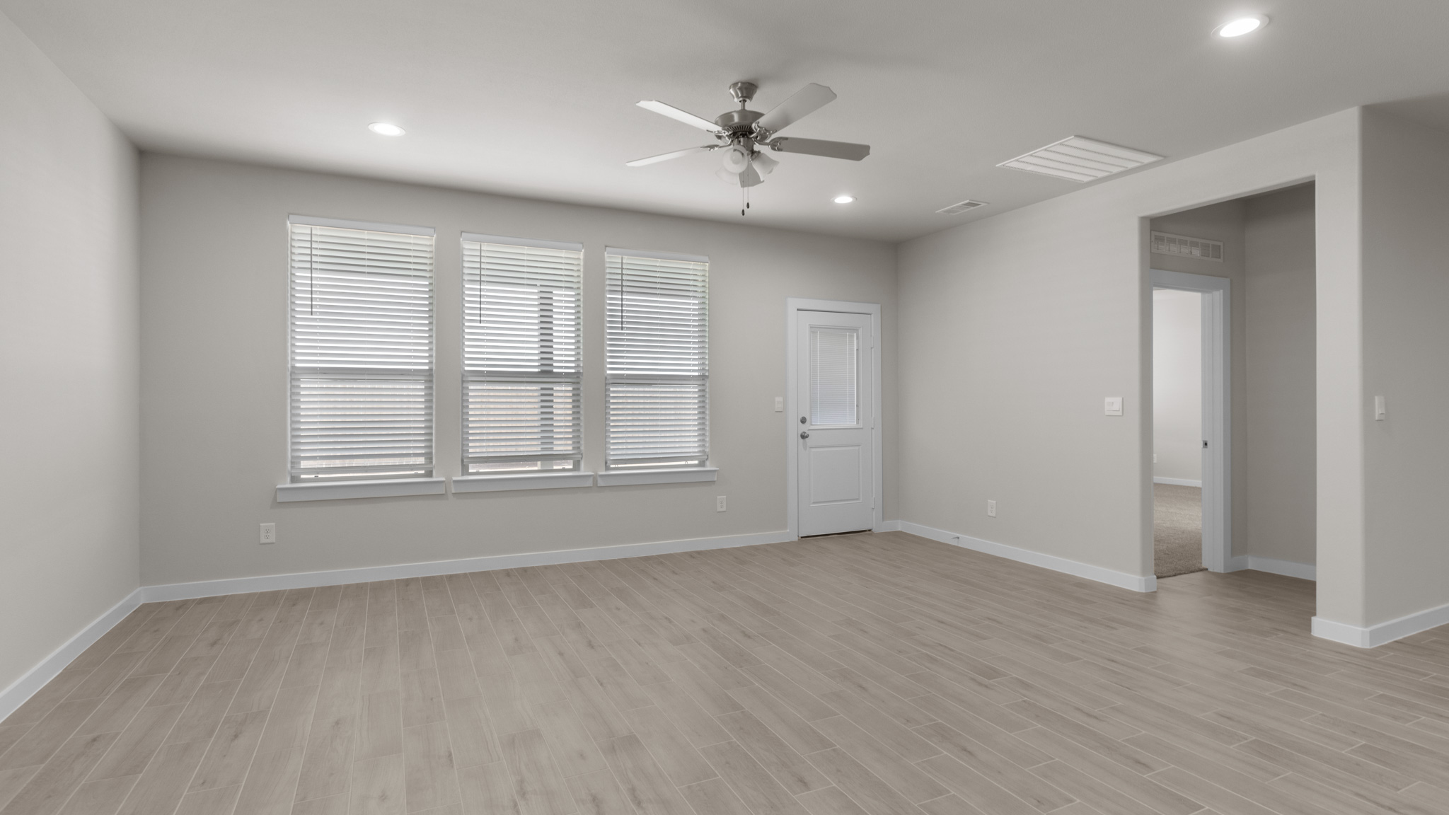 Living and family room area overlooking backyard
