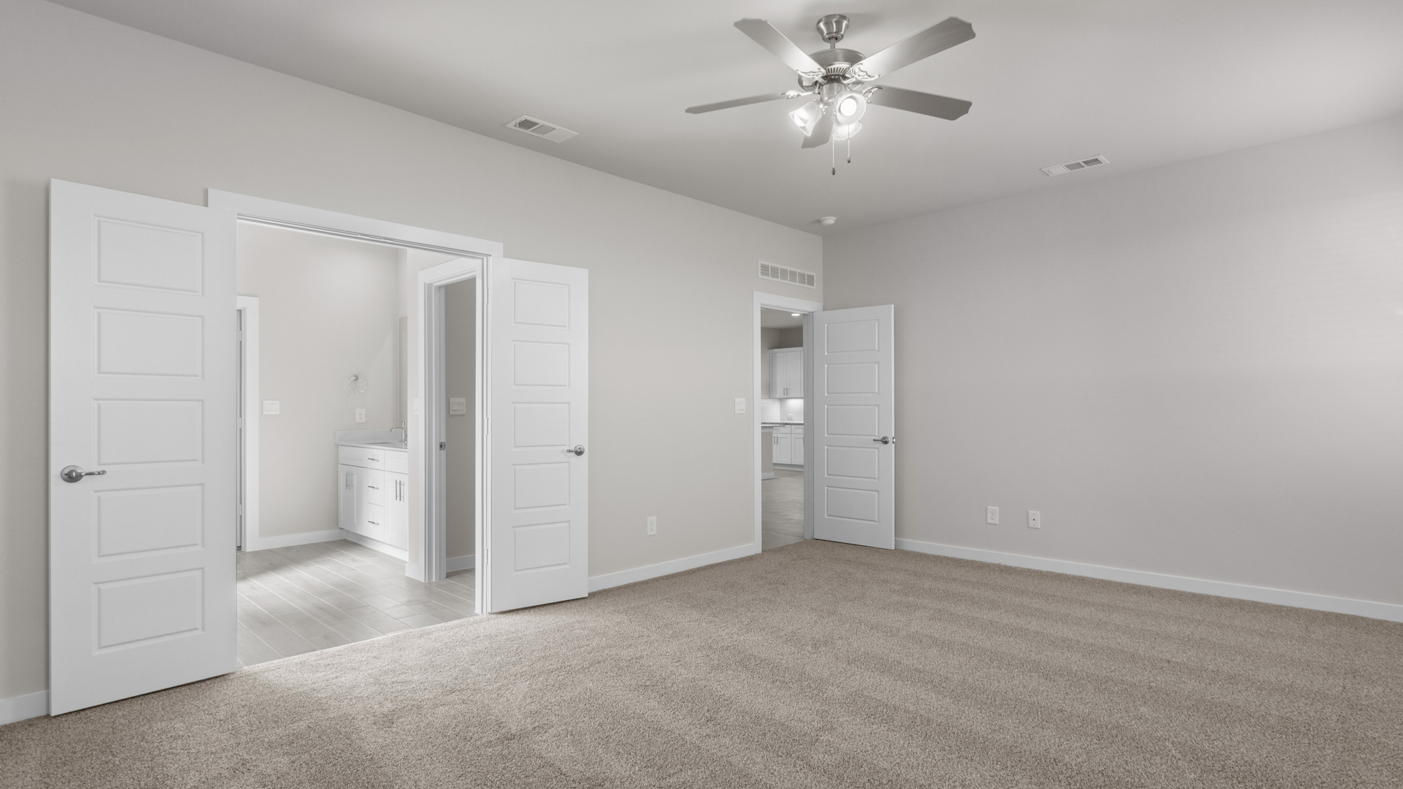 Primary bedroom complete with private attached bathroom