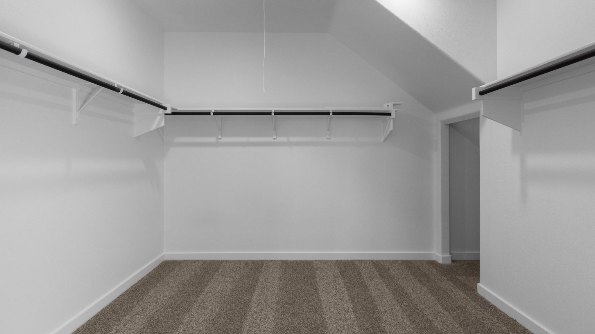 Oversized walk-in closet with ample storage space