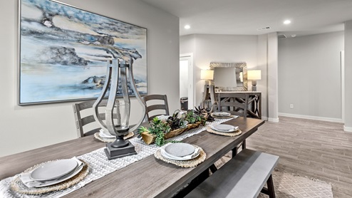 Formal dining room space to the side of the home with spacious front foyer entry