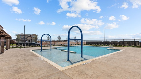 Side view of swimming pool and sun deck area for residents to enjoy