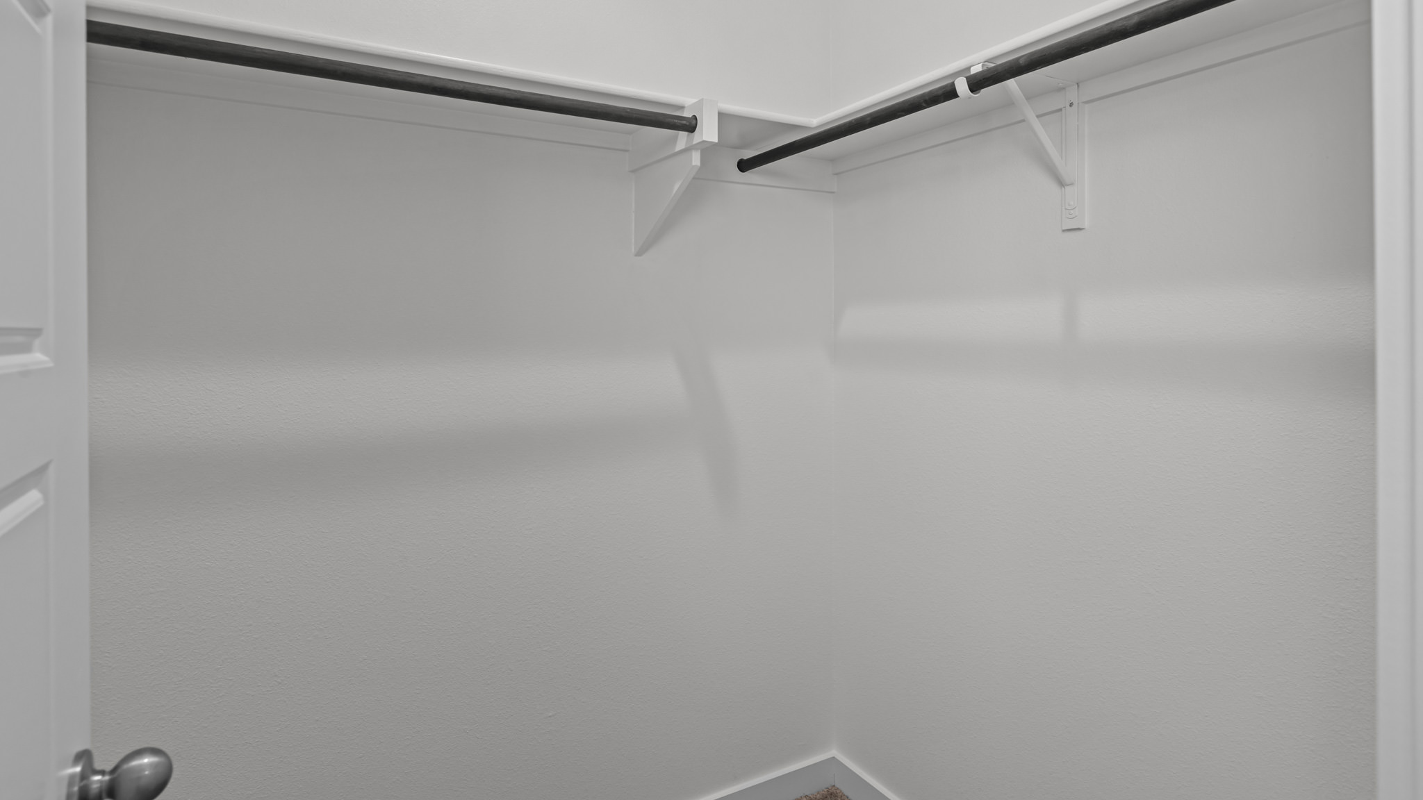 Primary walk-in closet with extra storage space