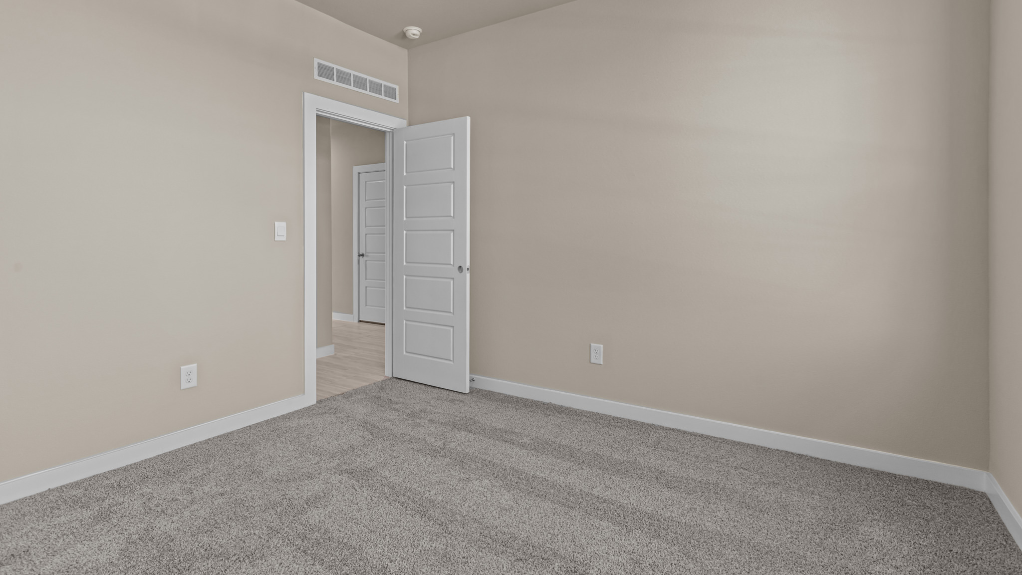Guest bedroom 1 with front windows and ample natural light