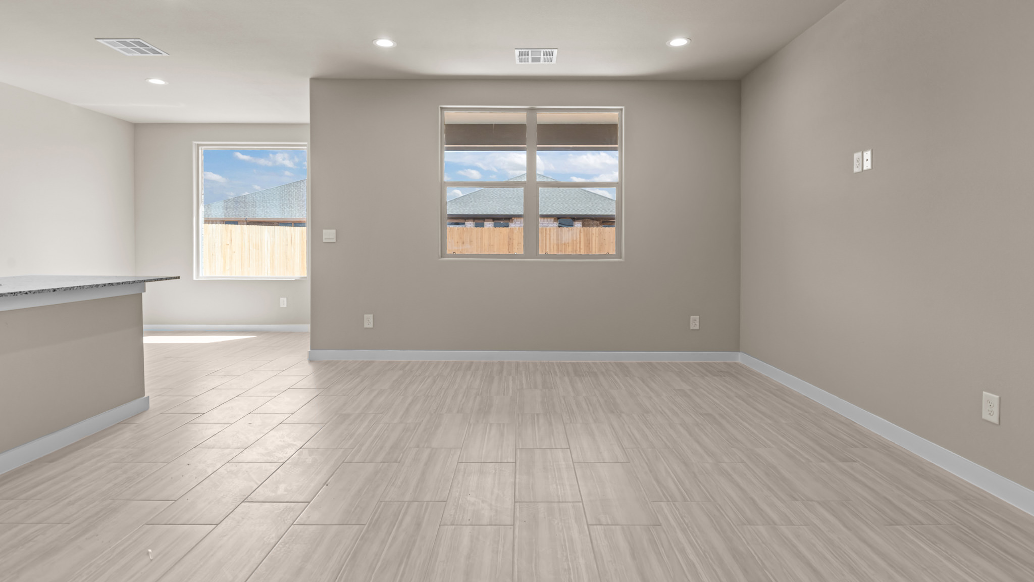 Open living and family room area with ample natural light