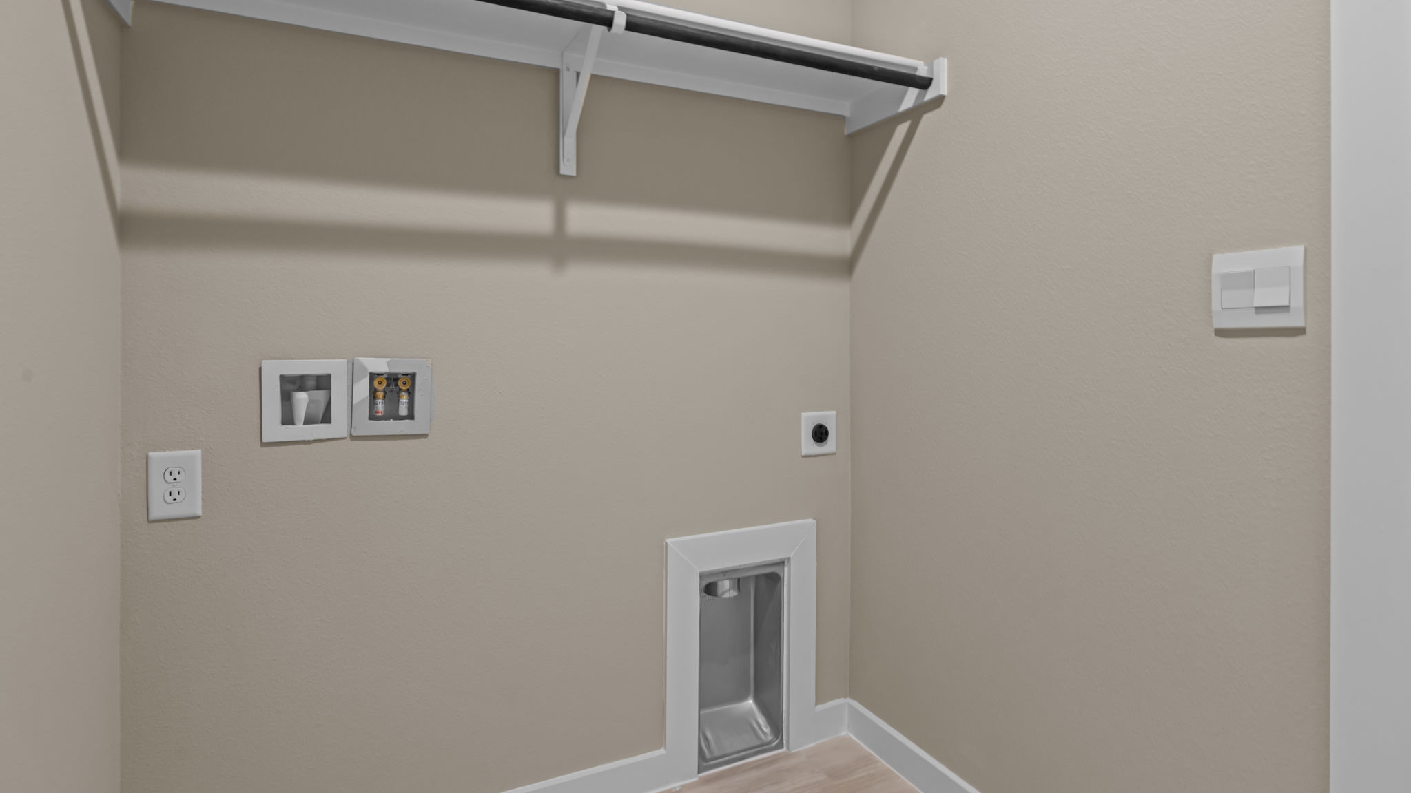 Laundry room and utility closet space with extra storage