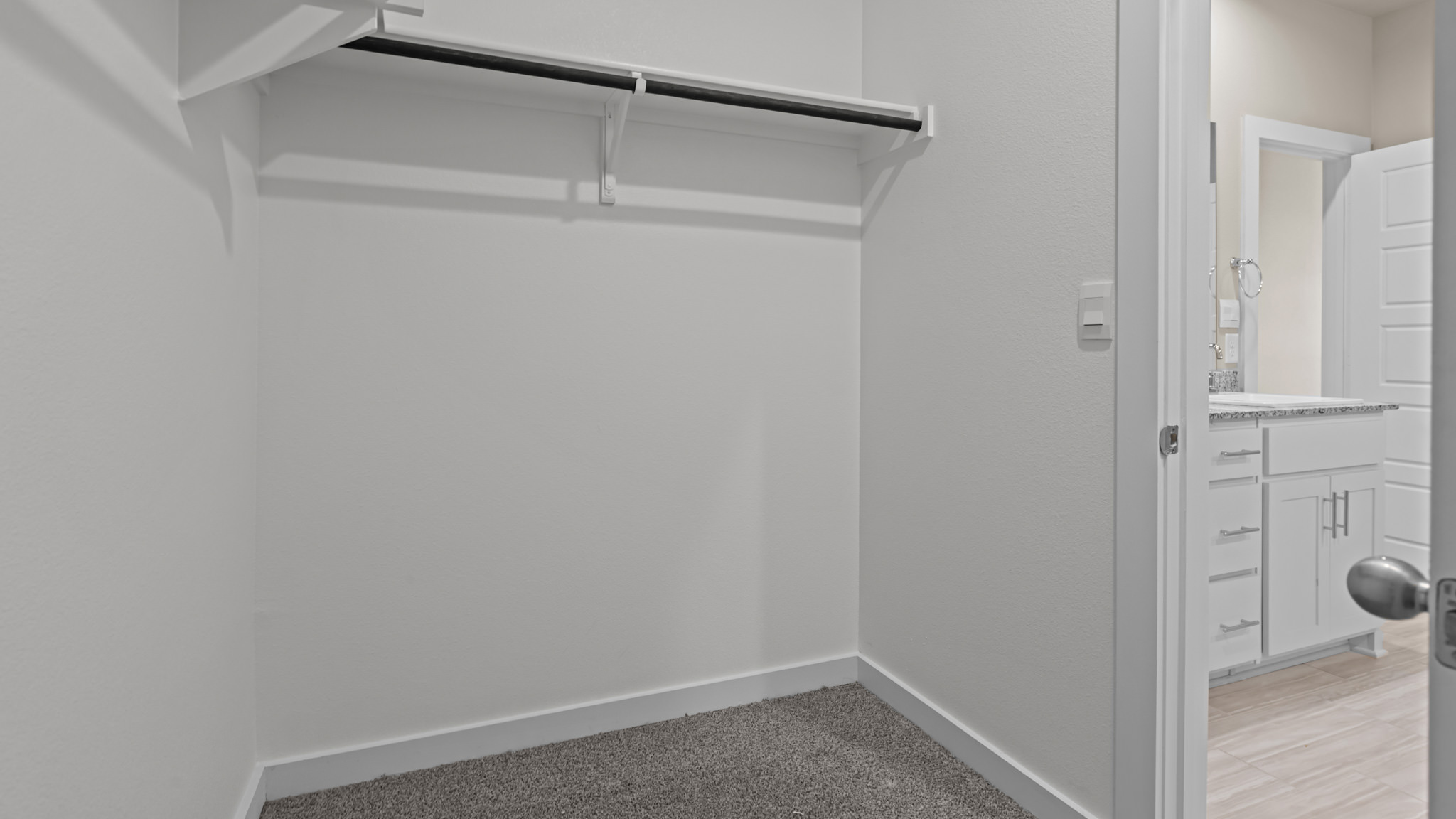 Primary walk-in closet with extra storage space