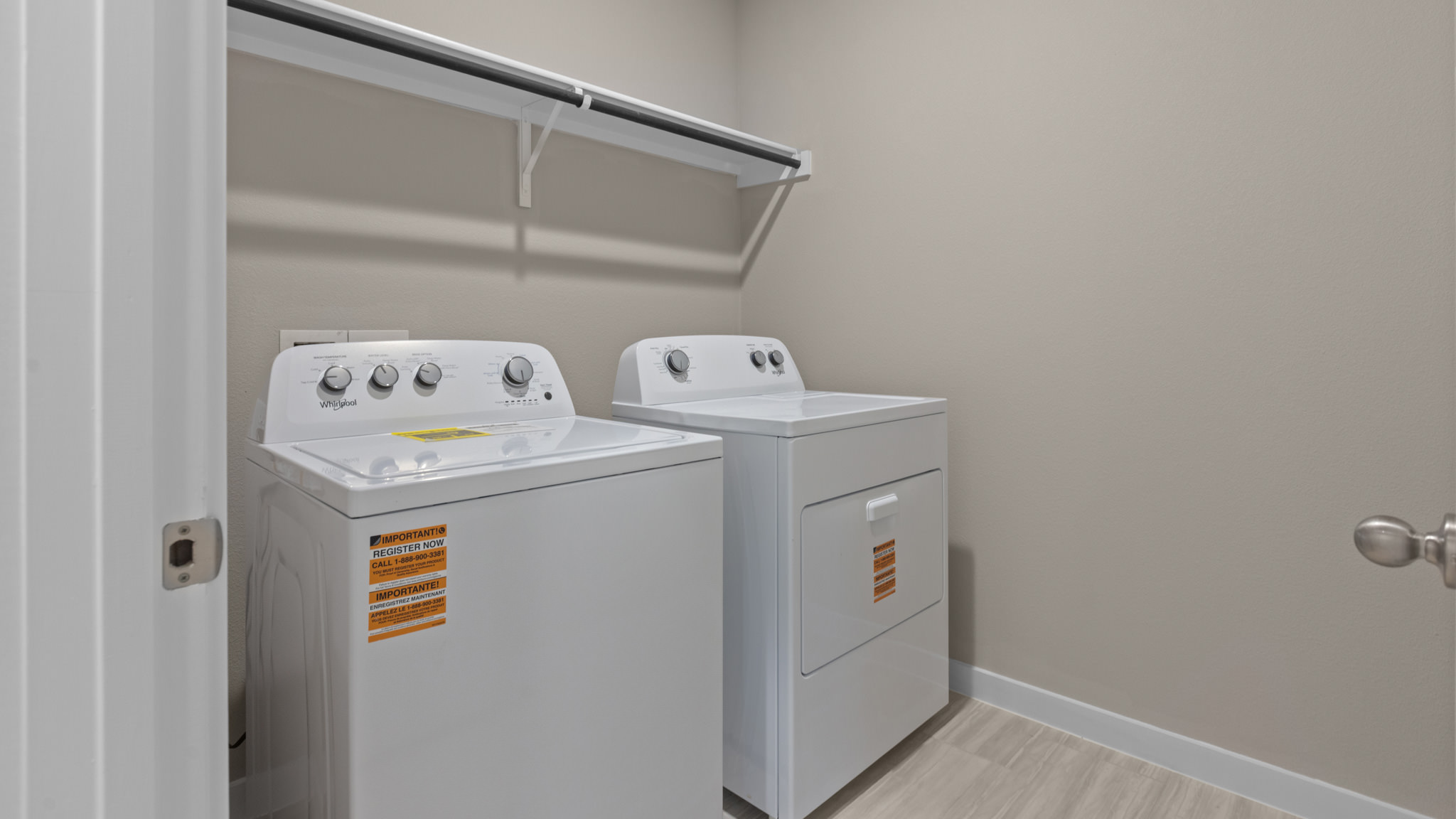 Laundry room and utility closet space with extra storage