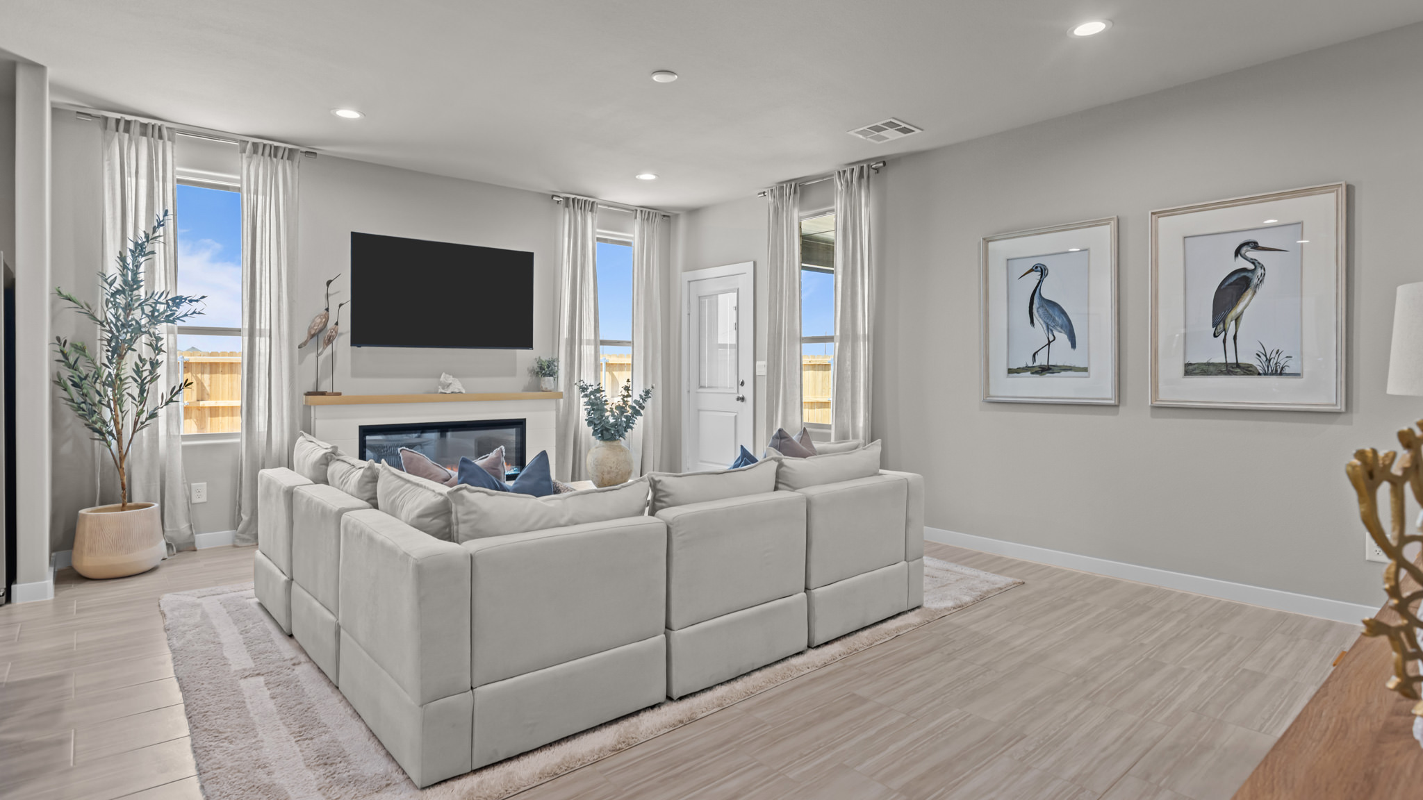 Open living and family room area with ample natural light