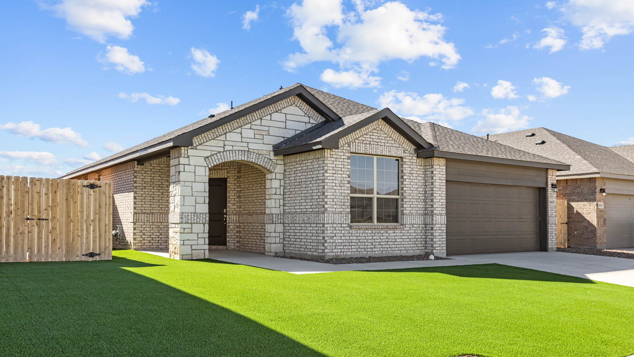 Side view of single story timeless brick home