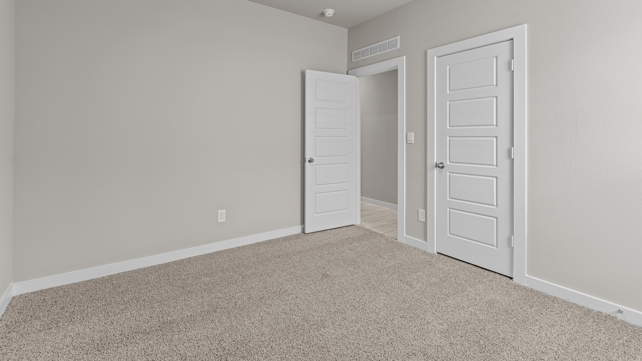 Guest bedroom 3 with plush carpet floors and spacious closet