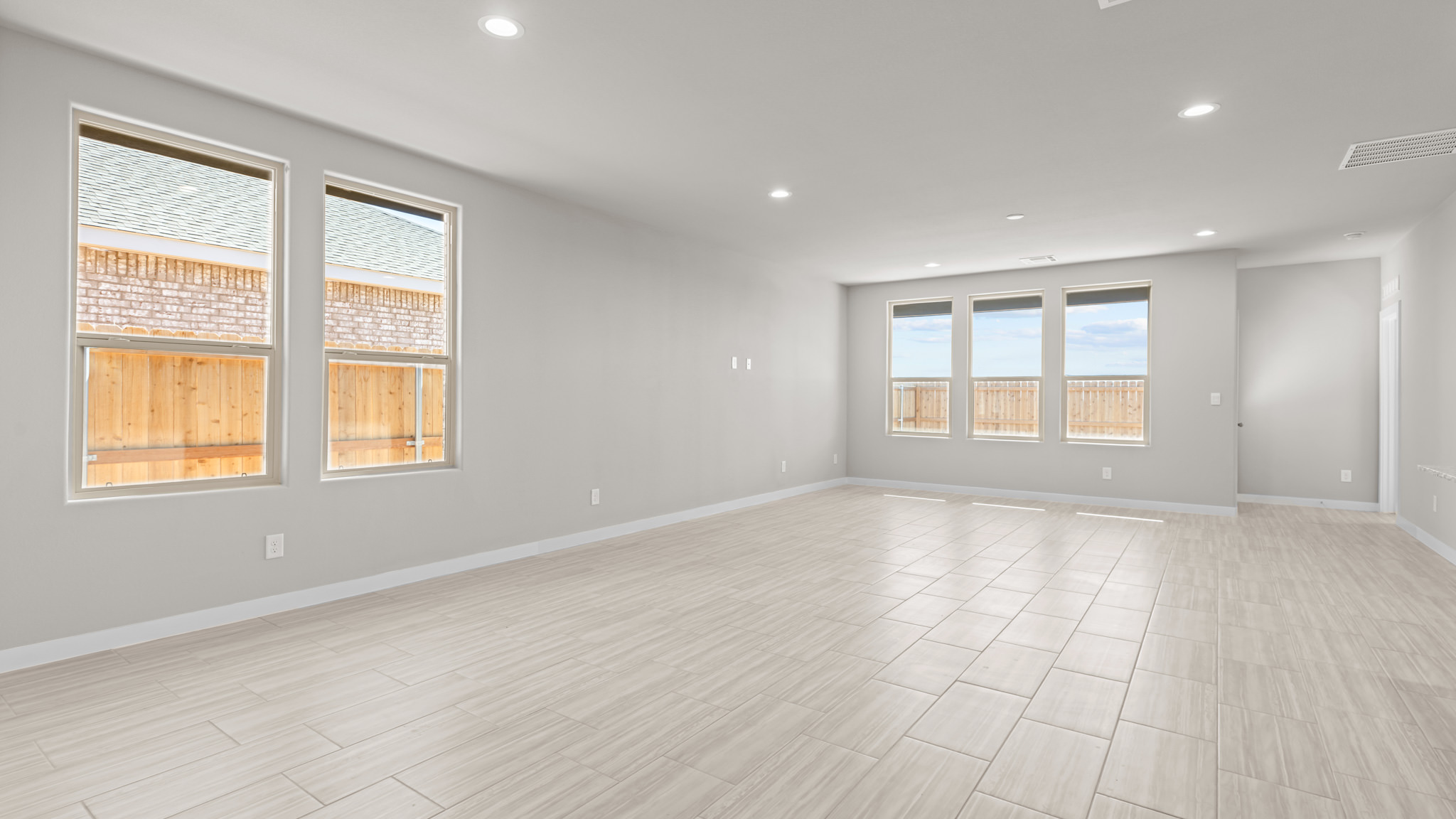 Open living and family room area with ample natural light