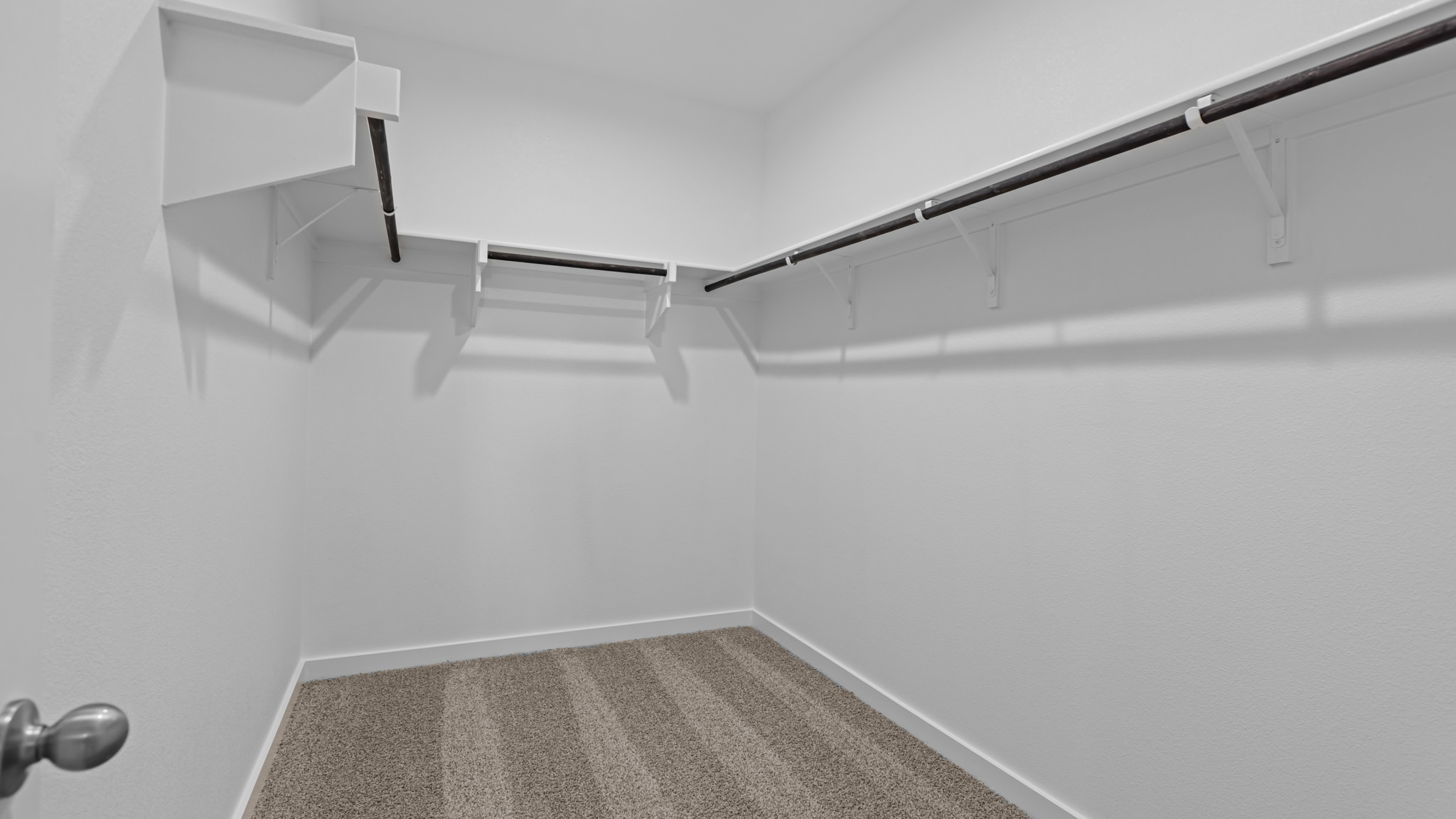 Primary walk-in closet with extra storage space
