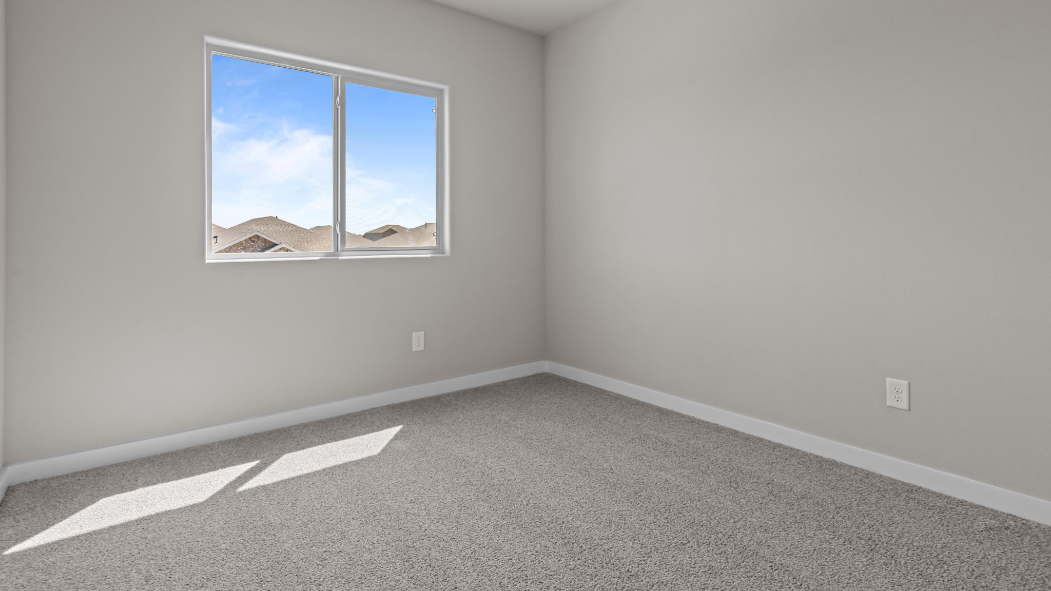 Upstairs guest bedroom 4 with plush carpet floors and side window
