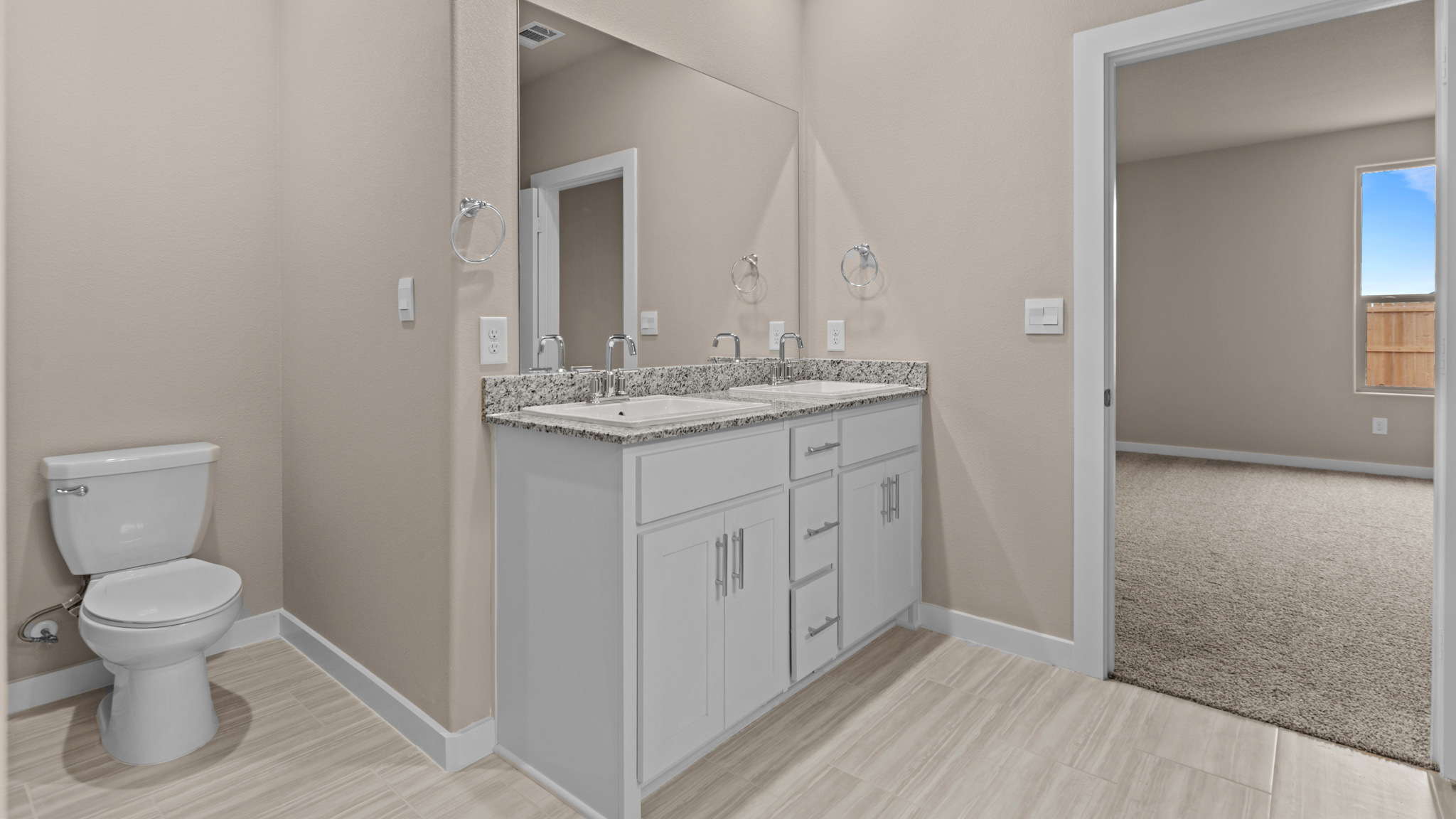 Private attached primary bathroom with built in vanity