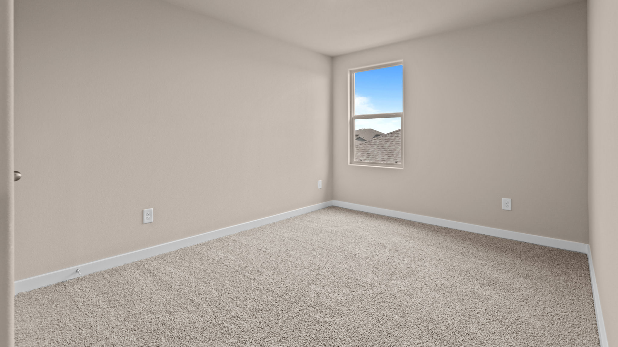 Guest bedroom 1 with front windows and ample natural light