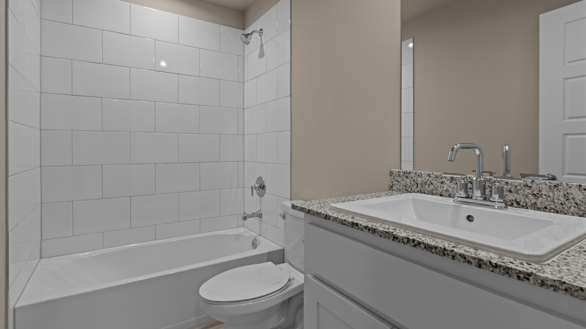 Guest bathroom located between guest bedrooms