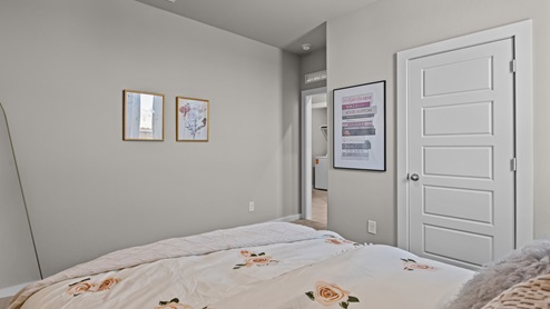 Guest bedroom used as a kids bedroom with pink and gold accents