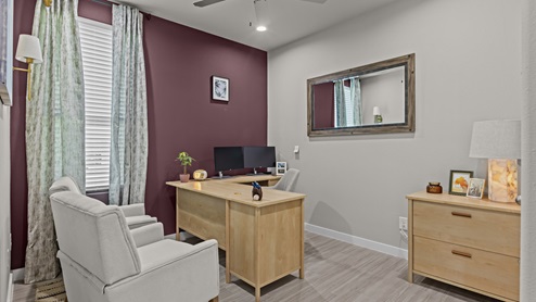 Guest bedroom 4 with side window and plush carpet with light wood furnishings