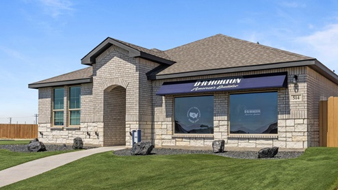 Exterior of classic brick one-story family home with front turf yard