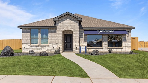 Exterior of single-story modern brick home with spacious front entry