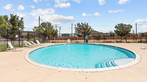 Community pool area with warm pool deck