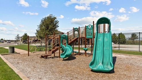 Open air community playground area with large play structure