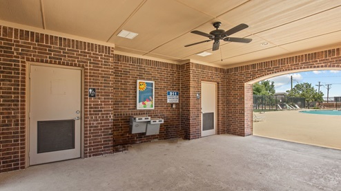 Covered community amenities center with conveniently located restrooms