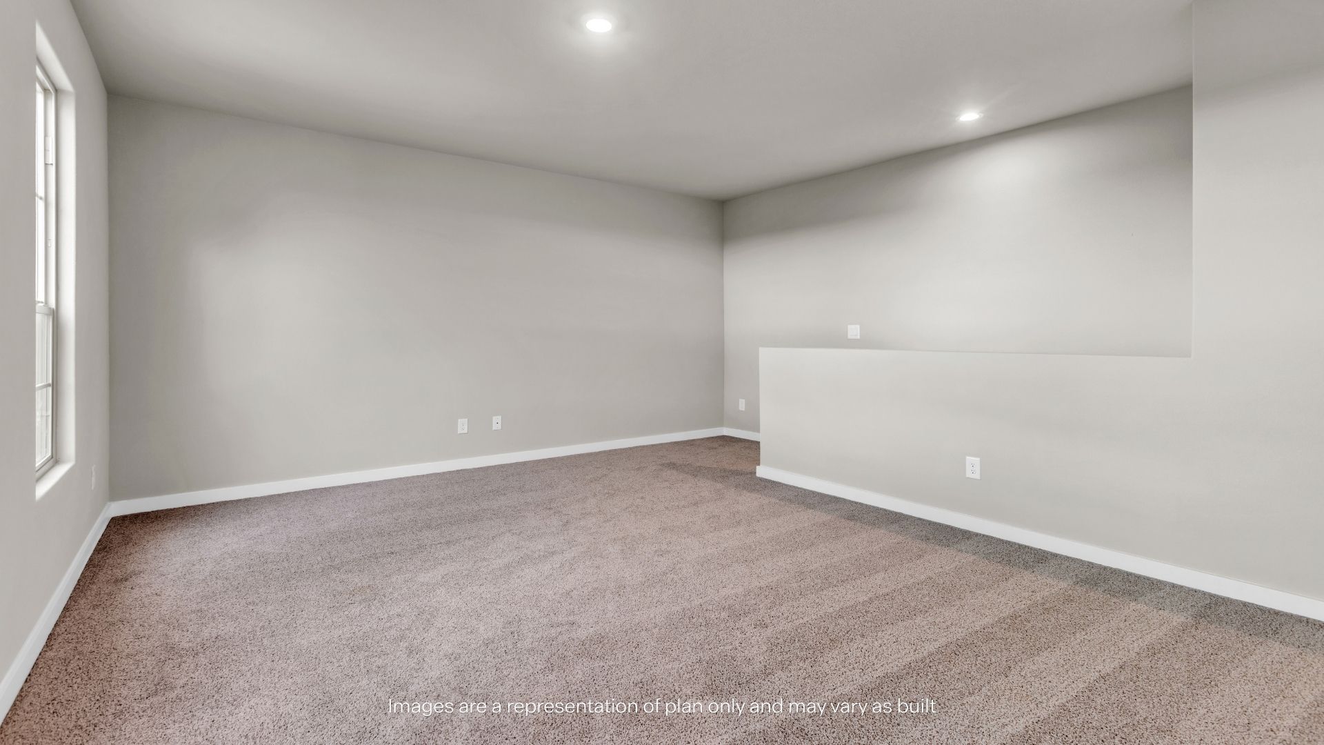 Spacious upstairs loft area offering versatile living space with neutral finishes and soft carpeting.