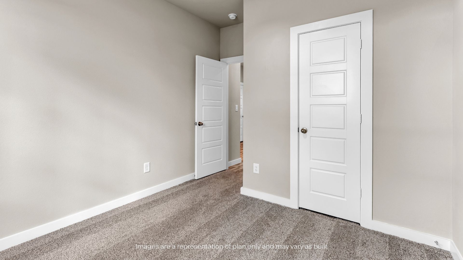 Comfortable secondary bedroom with soft carpeting, natural light, and a versatile layout for guests or family members.