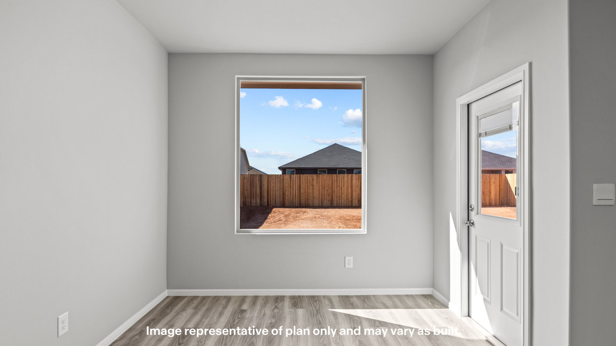 Cozy dining nook space to the side of the kitchen overlooking backyard