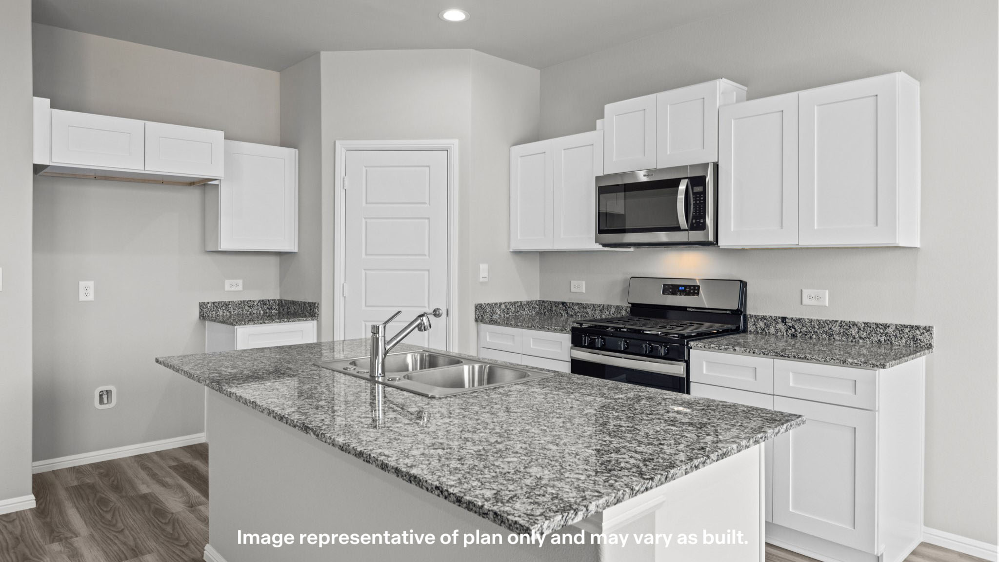 Open concept kitchen with stainless steel appliances, shaker style cabinets, and elevated finishes