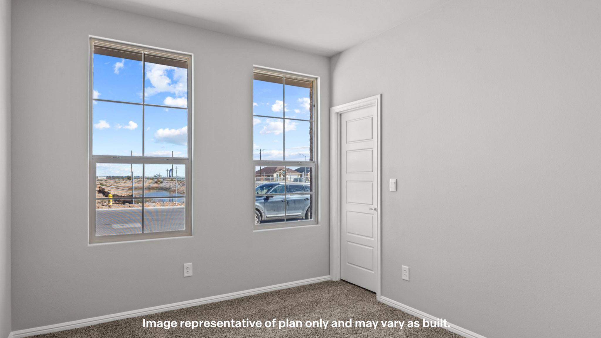 Guest bedroom 1 with front windows and ample natural light