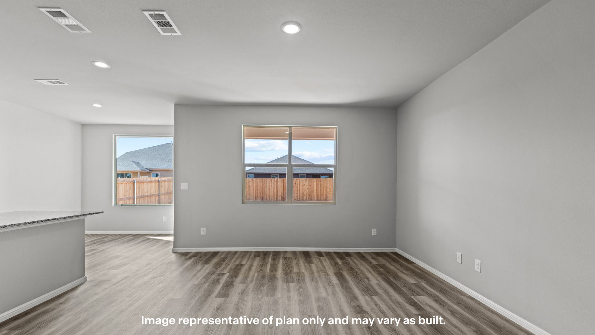 Open living and family room area with ample natural light