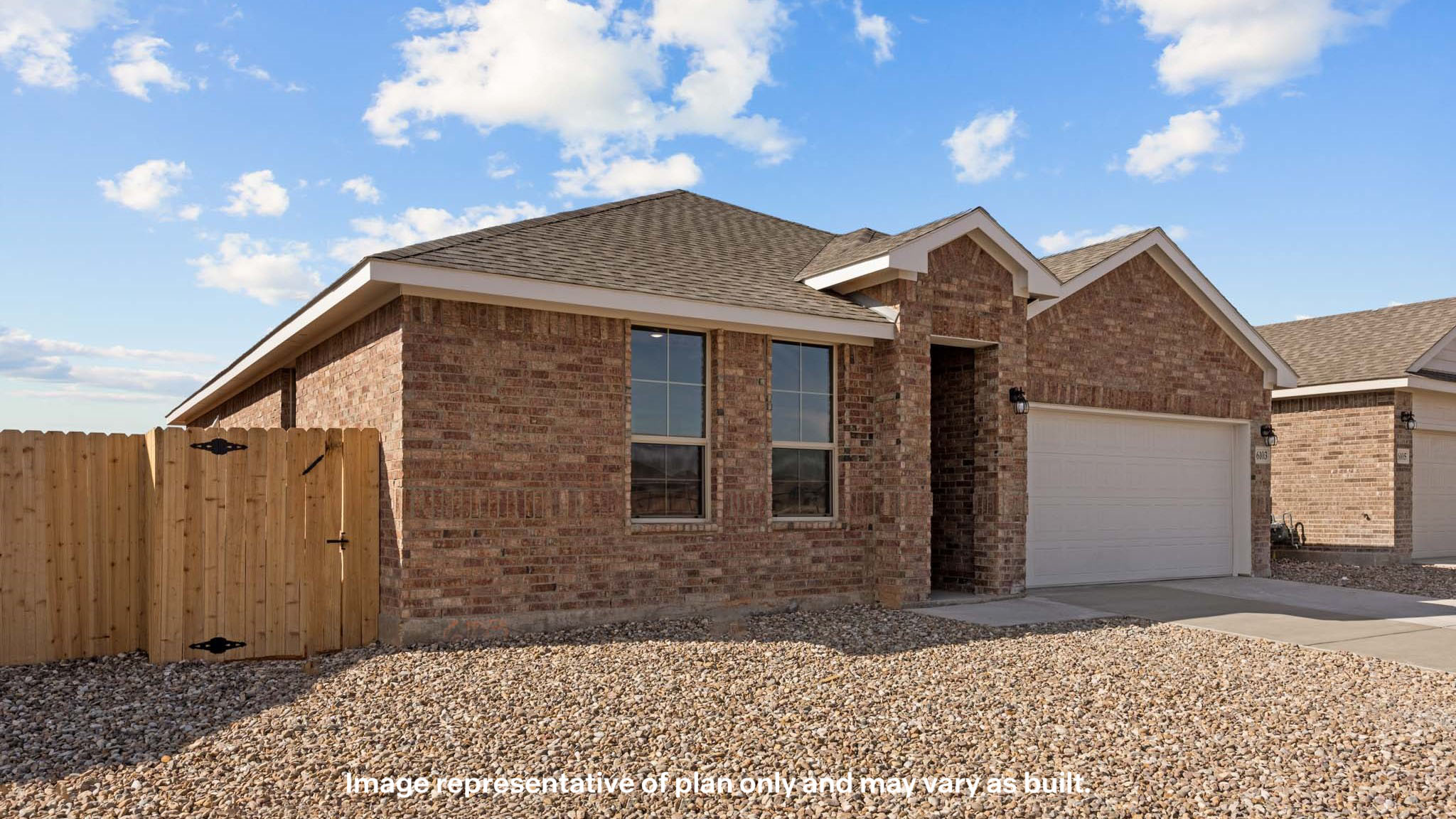 Side view of single story timeless brick home