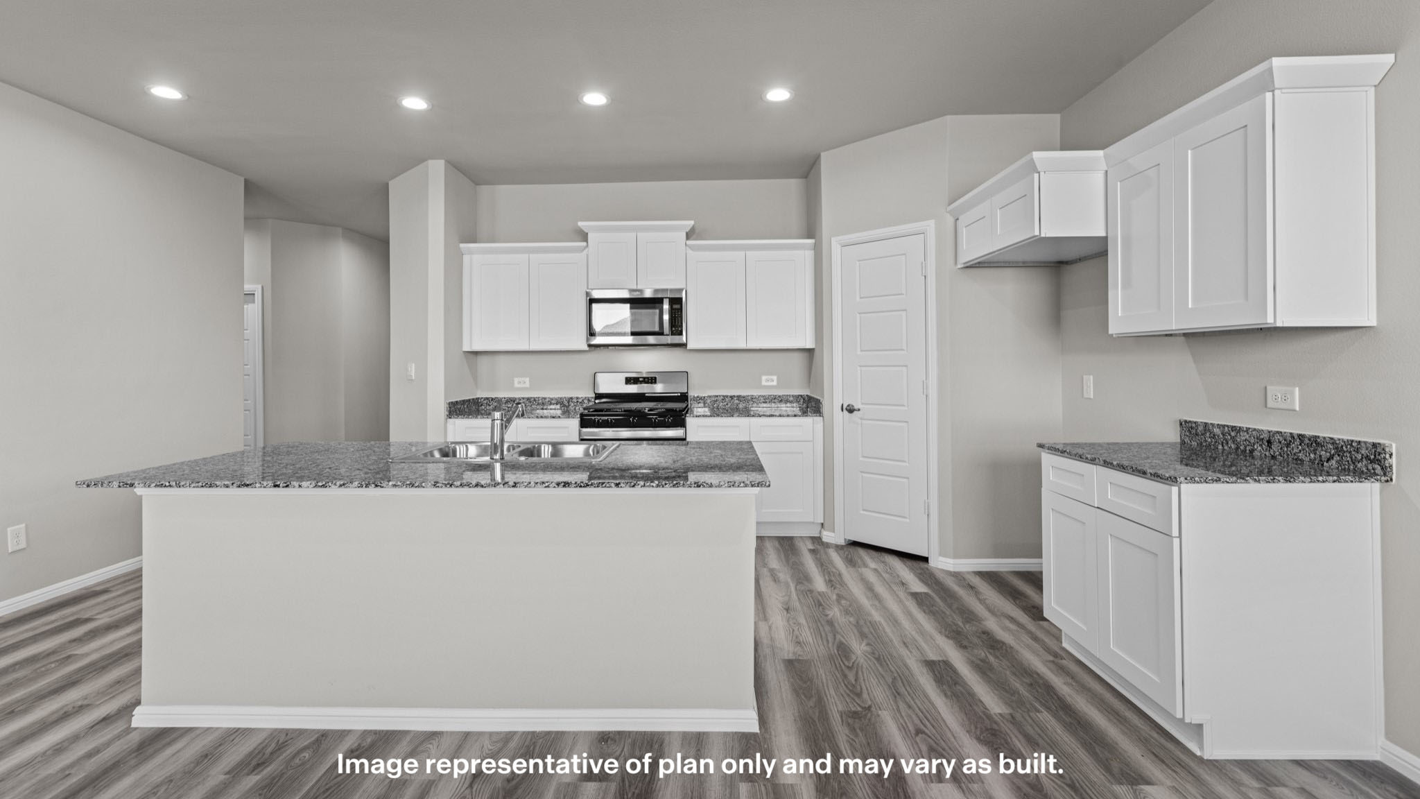 Spacious open concept kitchen with island and counter prep space