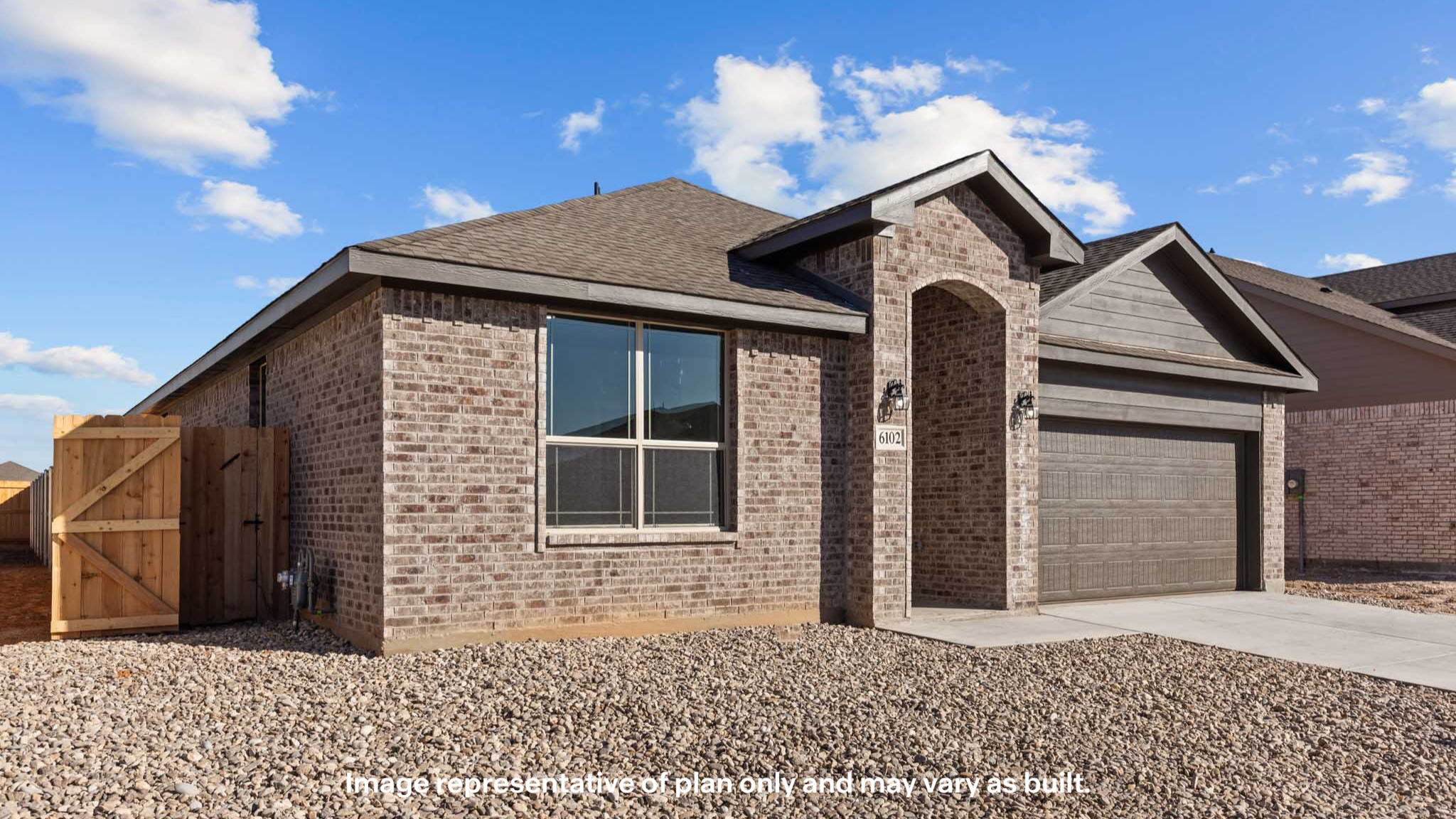 Side view of single story timeless brick home
