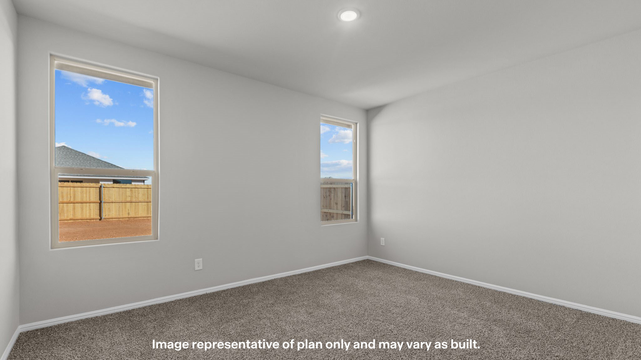 Primary bedroom with plush carpet floors and light allowing double windows