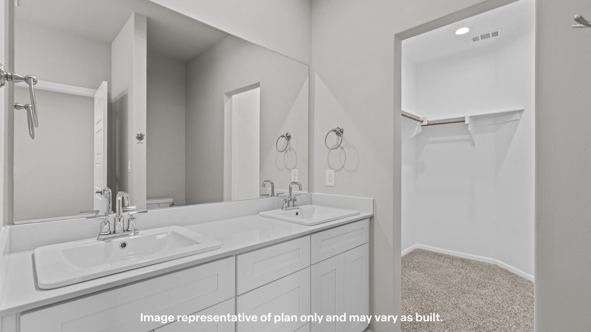 Private attached primary bathroom with built in vanity