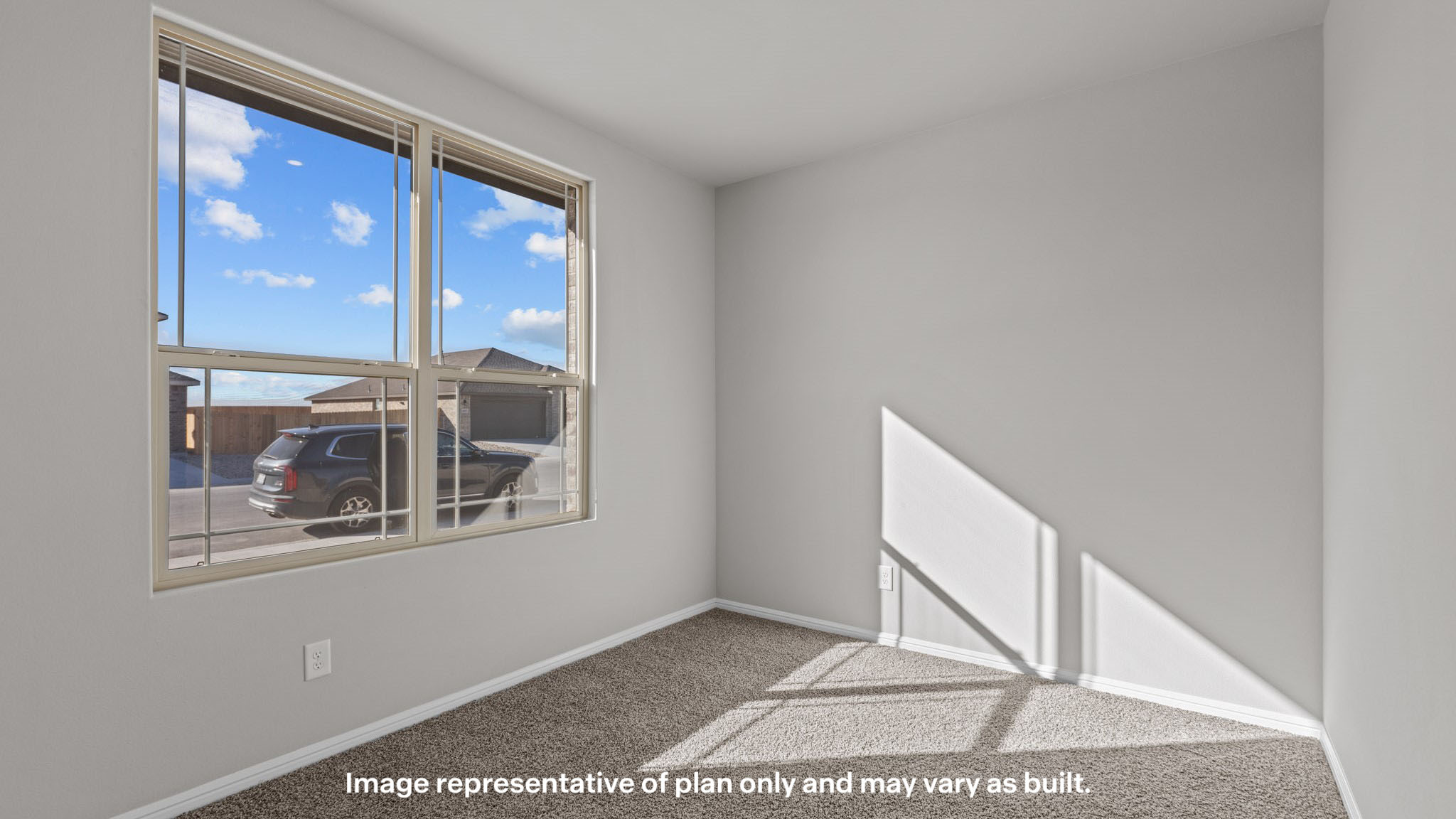 Guest bedroom 1 with front windows and ample natural light