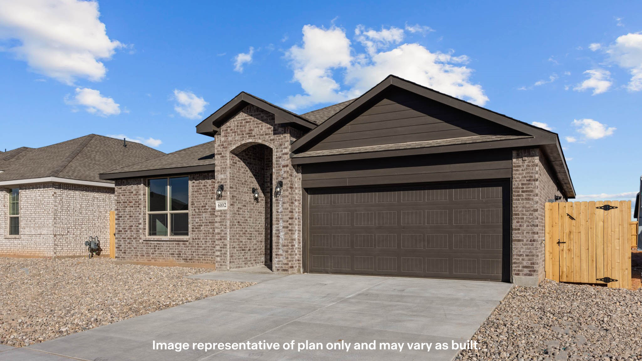 Side view of single story timeless brick home