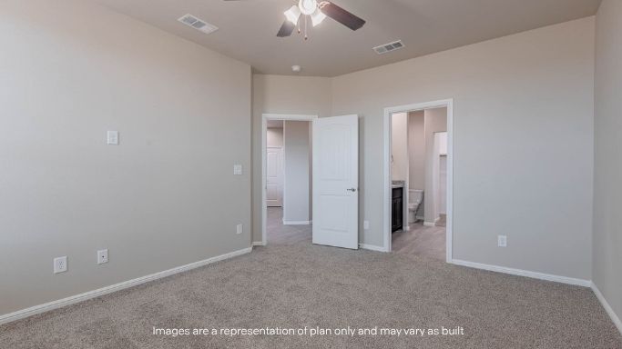 Primary bedroom with private attached bathroom and walk-in closet