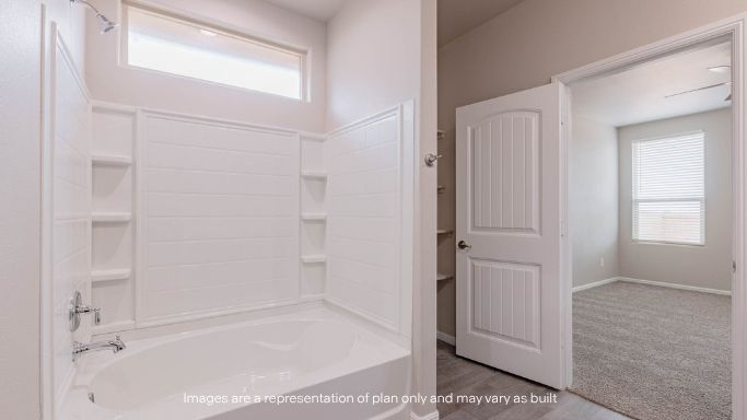 Private attached primary bathroom with built in vanity